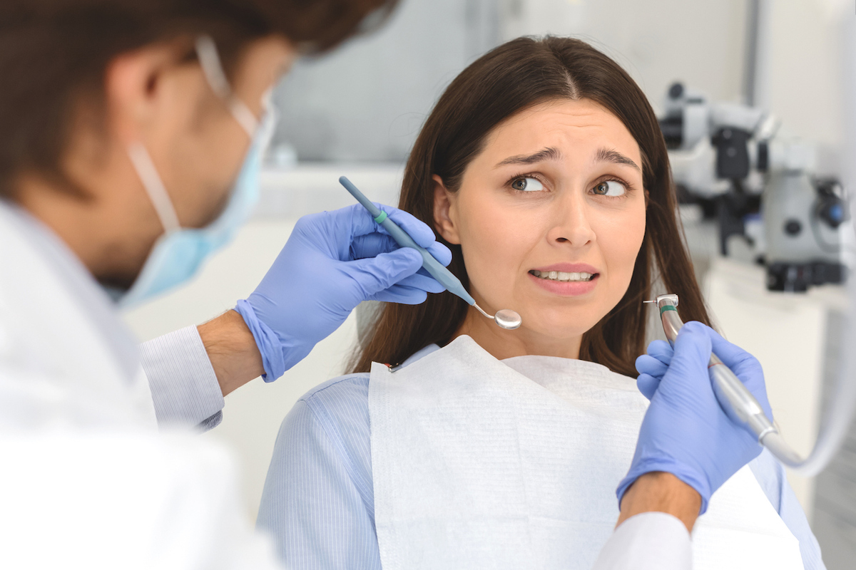 woman sitting in dental chair before exam
